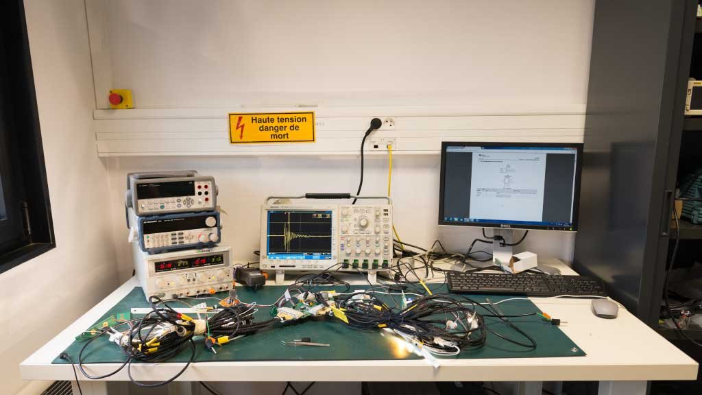Electronics engineering office — engineer on technical drawings