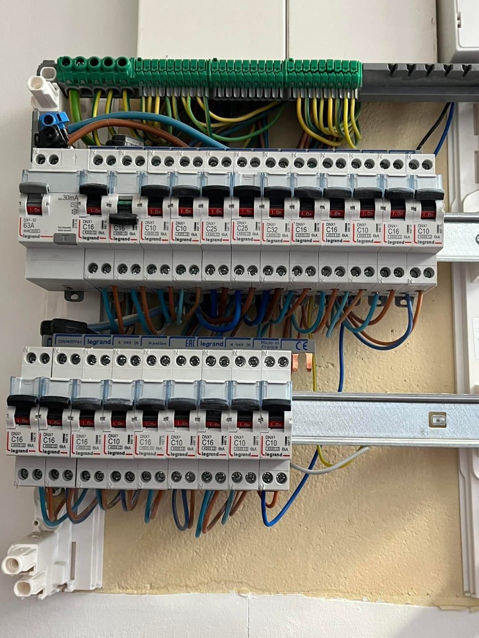 Multi-row electrical panel — wired circuit breakers